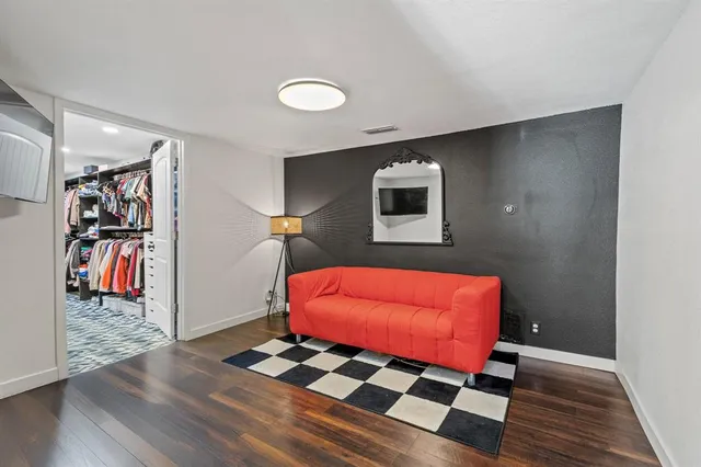 a view of a livingroom with furniture and workspace