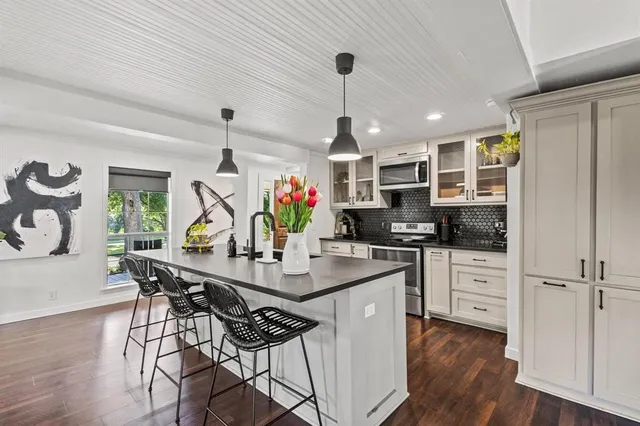 a kitchen with counter space and wooden floor