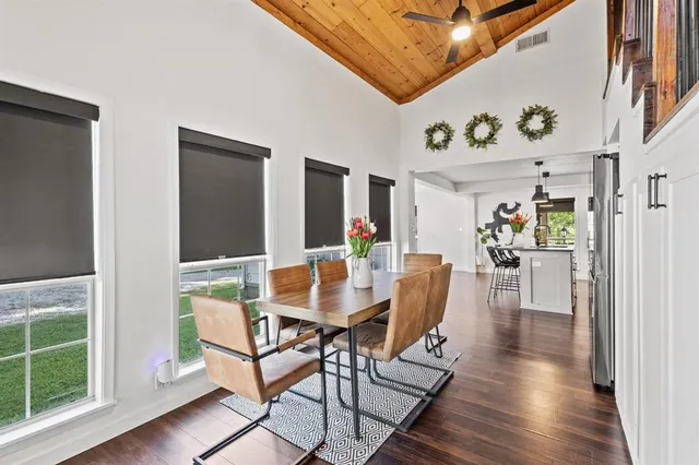 a view of a dining room with furniture window and wooden floor