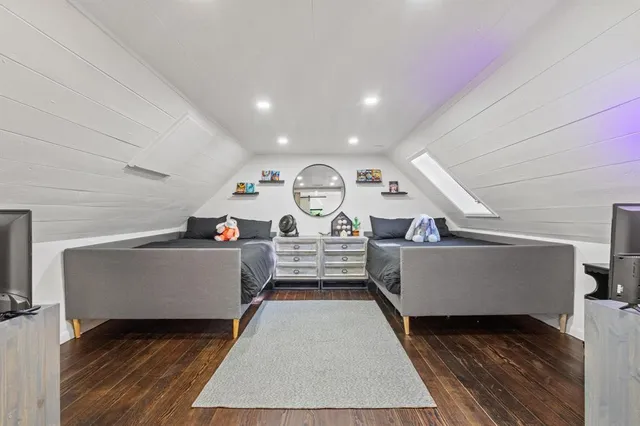 a view of living room with furniture and wooden floor