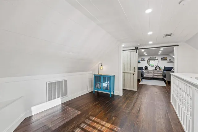a view of a livingroom with wooden floor