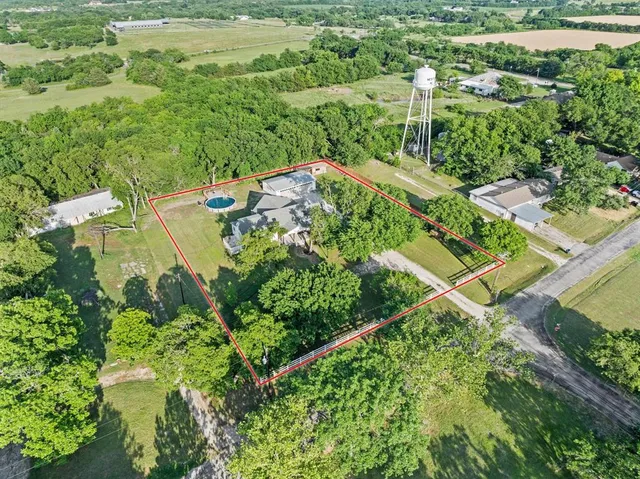 an aerial view of residential house with outdoor space and street view