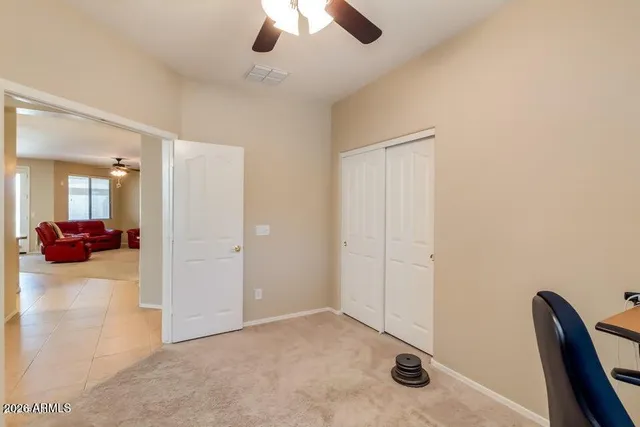 a view of a livingroom and a chandelier fan