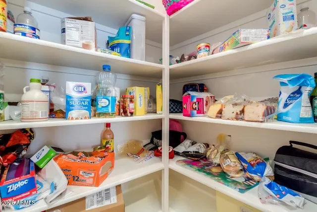 a utility room with lots of clutter and toys