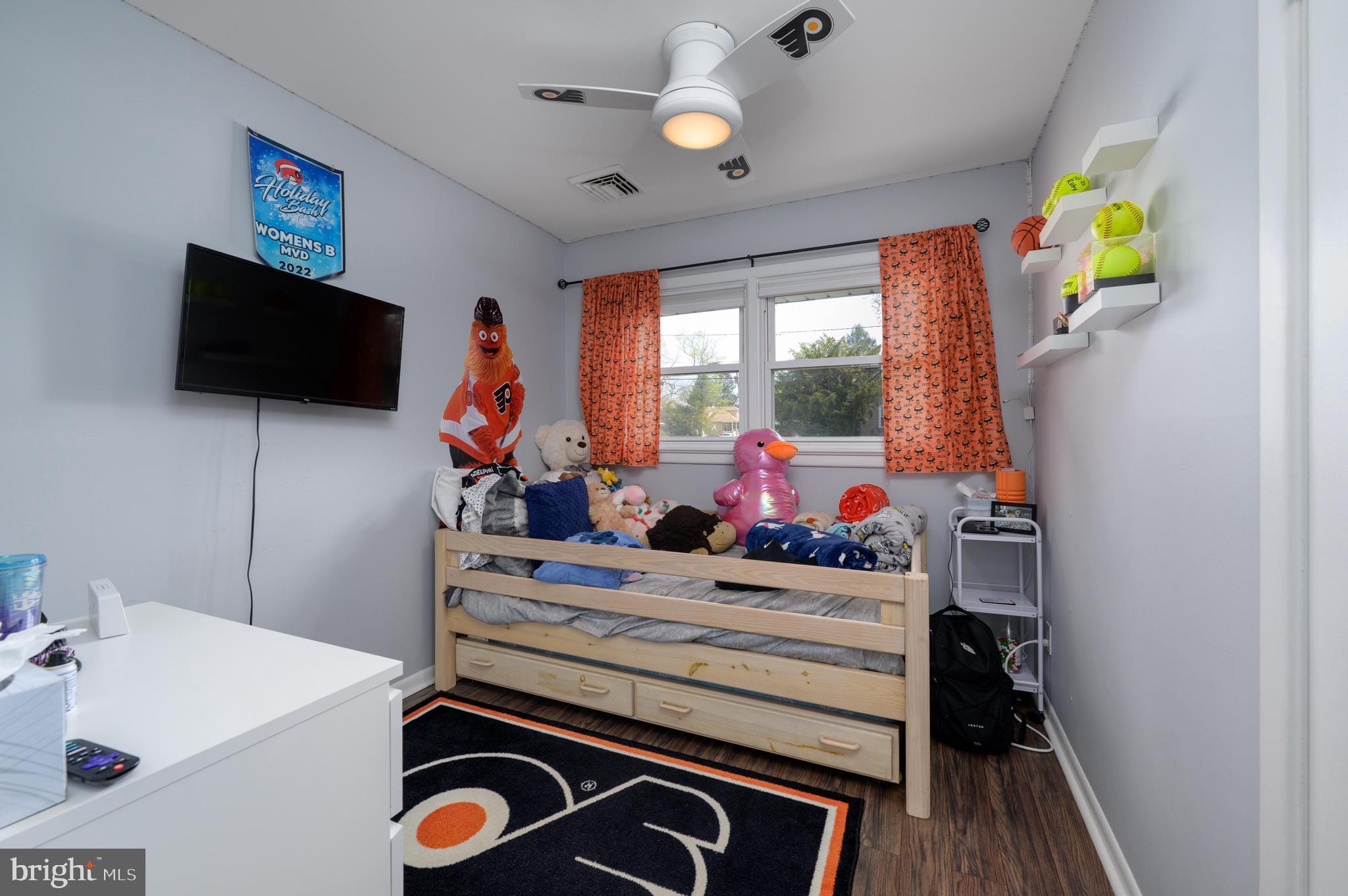 500 Jackson Avenue Magnolia, NJ 08049 - Photo 12 of 21 a view of a workspace with furniture and a flat screen tv