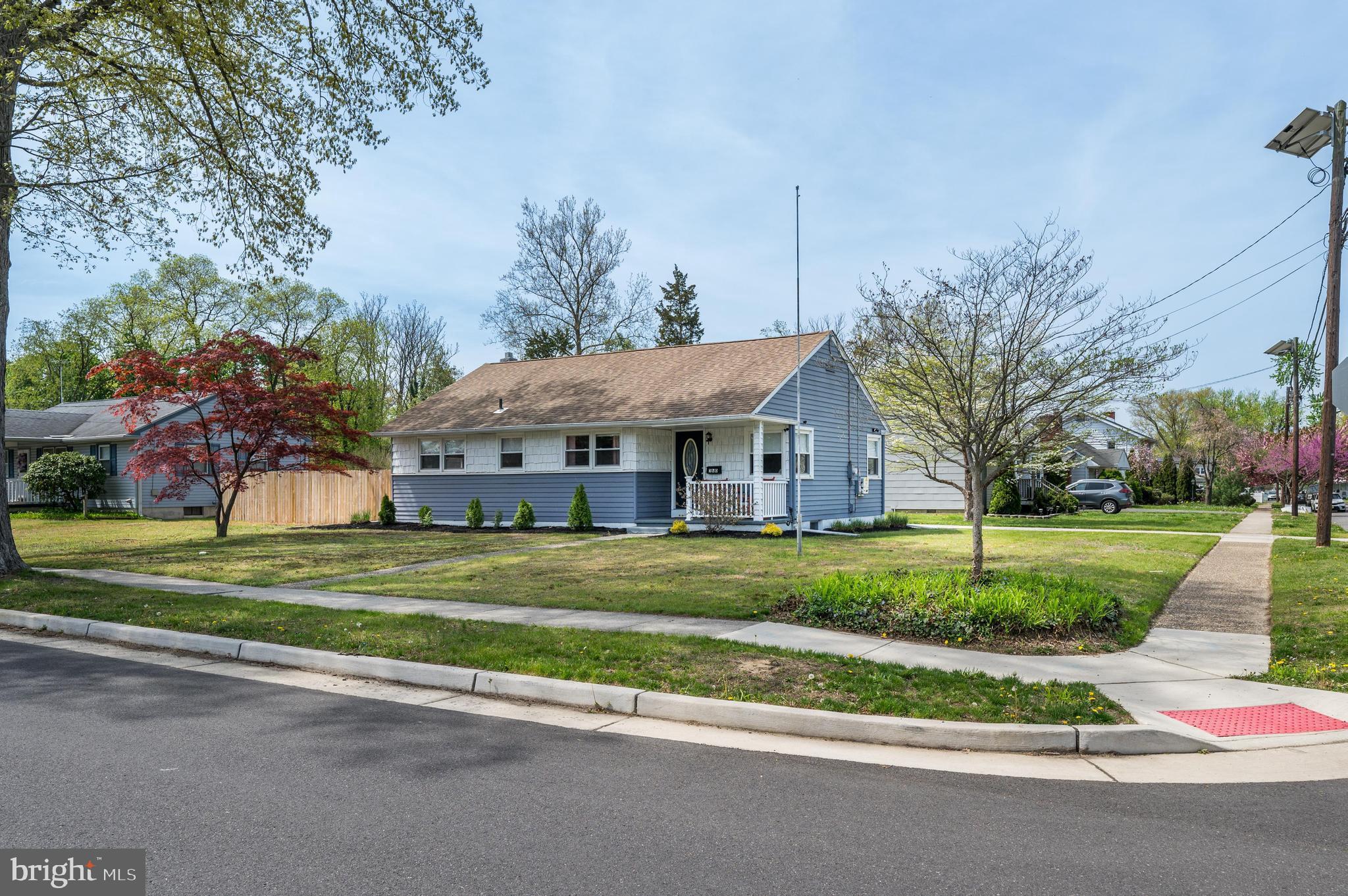 500 Jackson Avenue Magnolia, NJ 08049 - Photo 21 of 21 a front view of house with a garden and trees