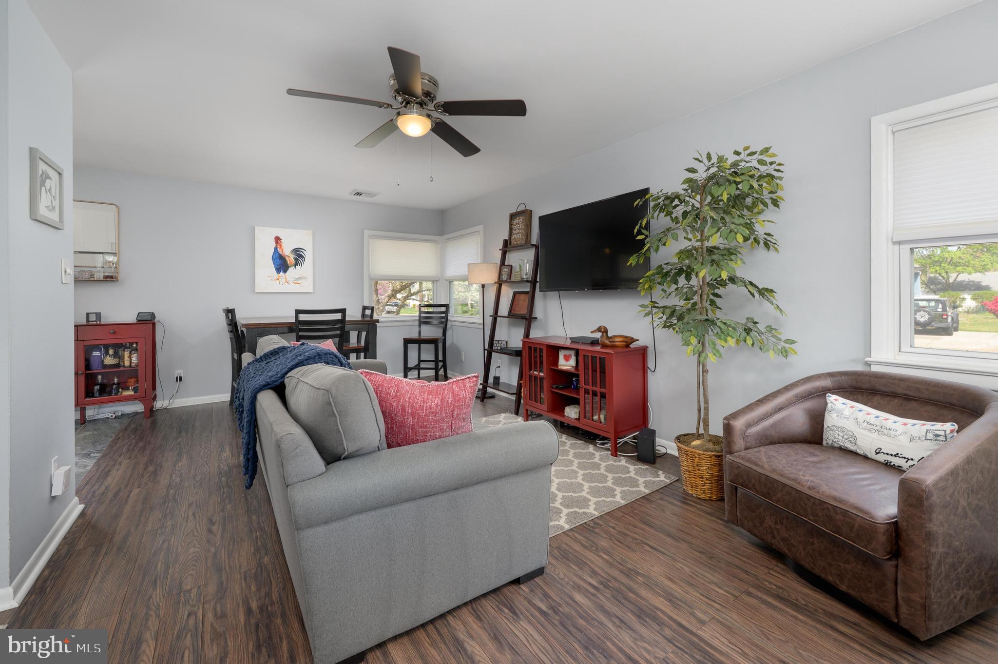 500 Jackson Avenue Magnolia, NJ 08049 - Photo 3 of 21 a living room with furniture and a flat screen tv