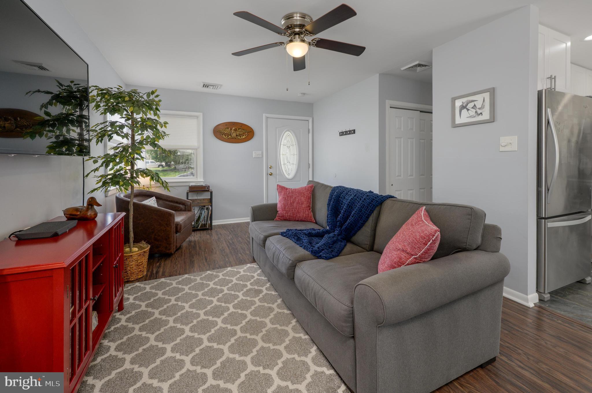 500 Jackson Avenue Magnolia, NJ 08049 - Photo 4 of 21 a living room with furniture and a chandelier