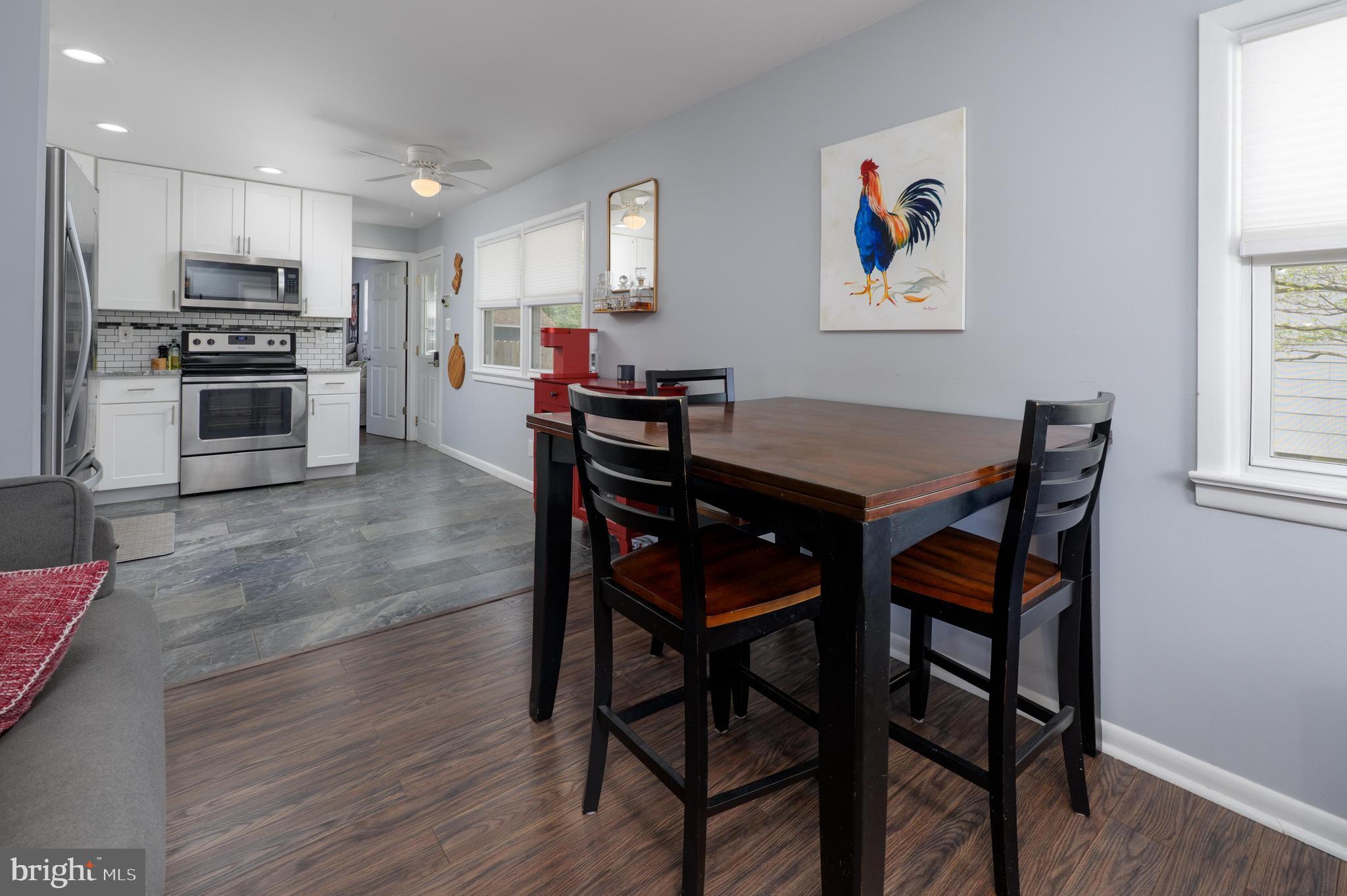 500 Jackson Avenue Magnolia, NJ 08049 - Photo 5 of 21 a view of a dining room with furniture and wooden floor