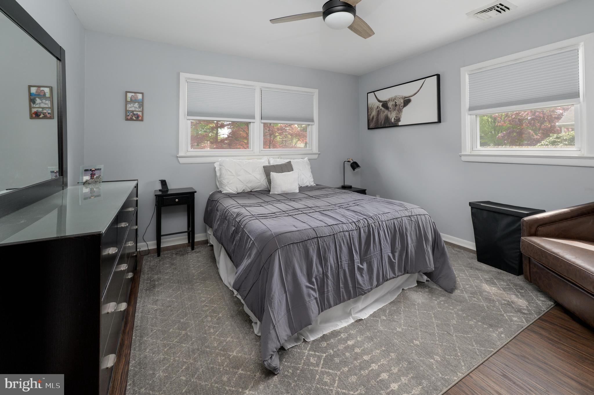 500 Jackson Avenue Magnolia, NJ 08049 - Photo 10 of 21 a bedroom with a bed and a table in it