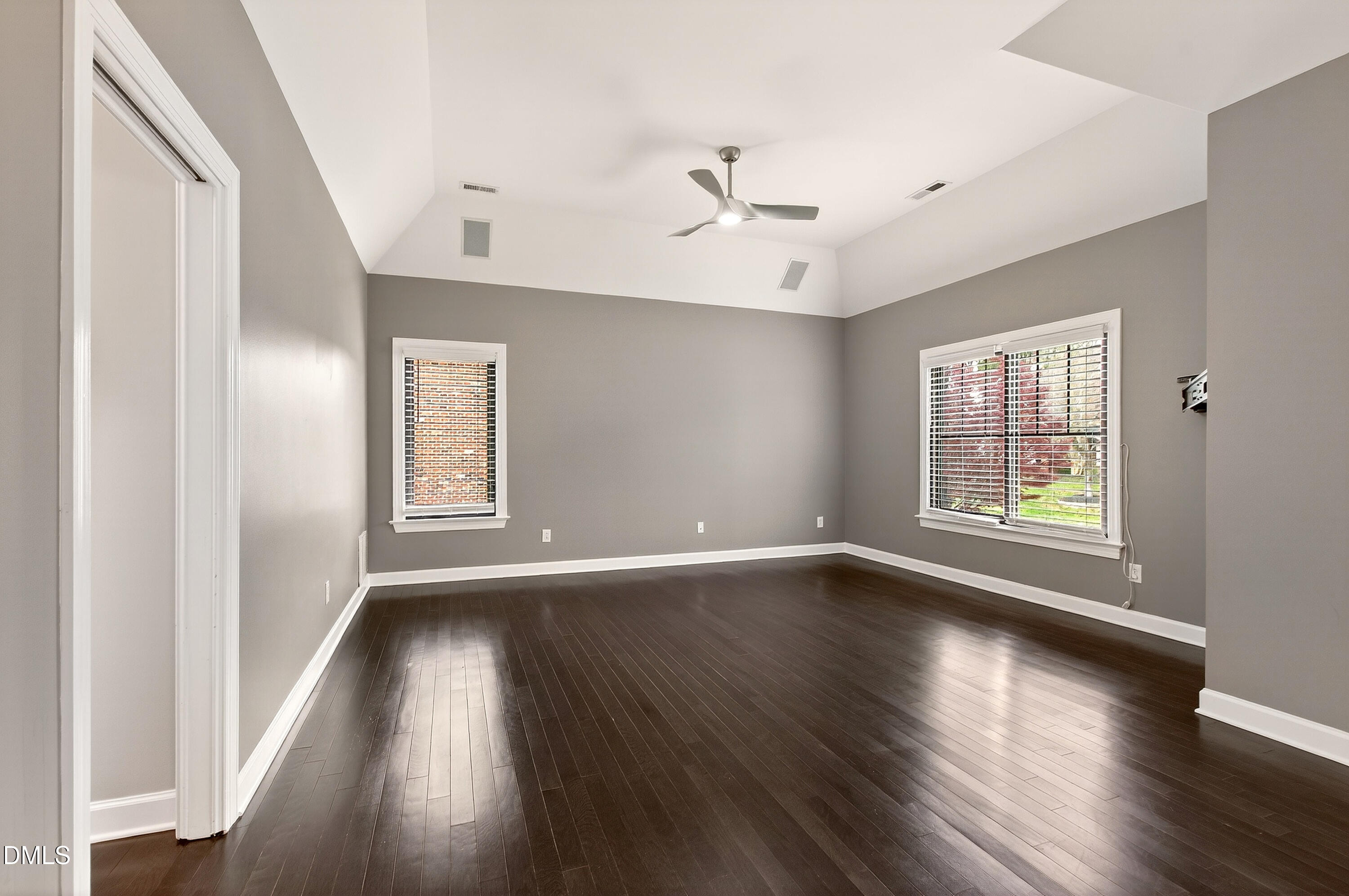 12408 Cilcain Court Raleigh, NC 27614 - Photo 43 of 80 a view of an empty room with wooden floor and a window