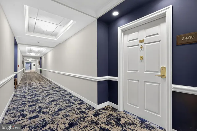 a view of a hallway with a bedroom
