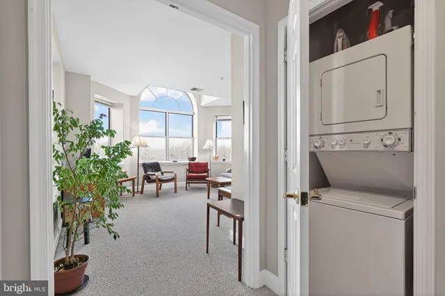 a view of living room filled with furniture and entryway
