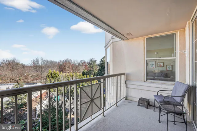 a view of a chair and table in balcony