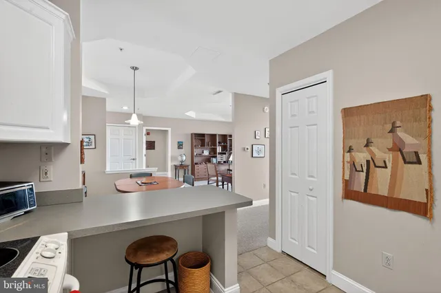 a kitchen with a table and chairs