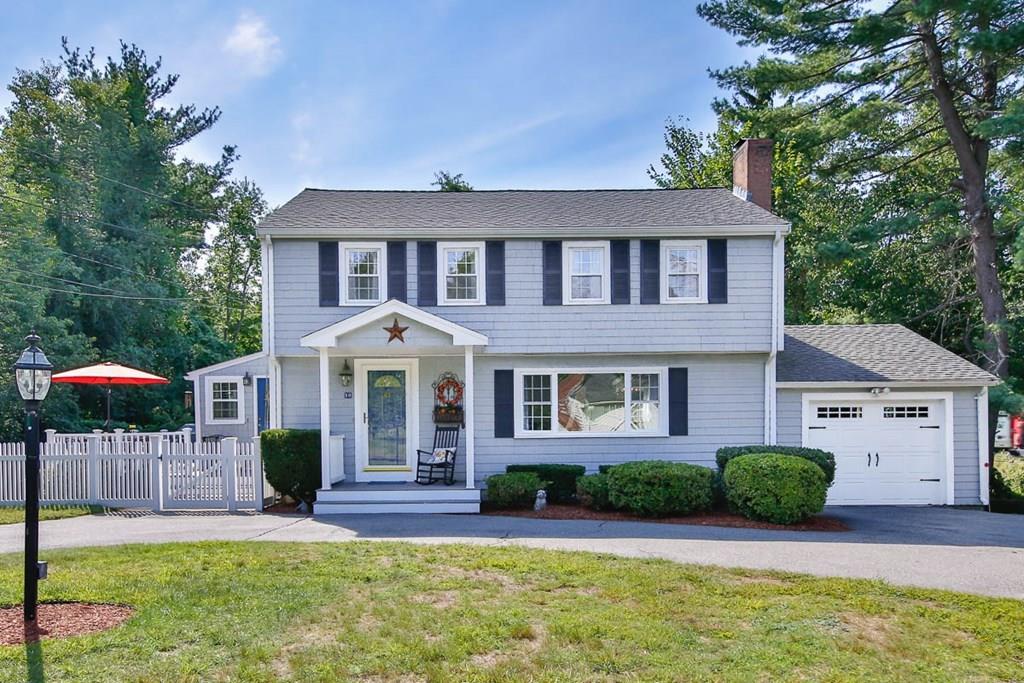 10 Ross Road Lexington, MA 02421 - Photo 1 of 36 a front view of a house with a yard and potted plants