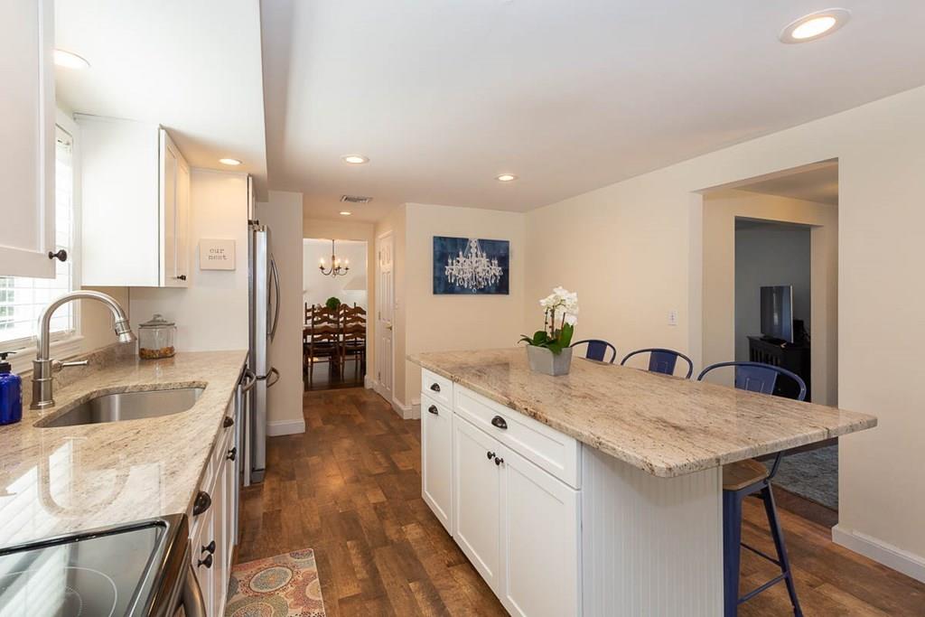 10 Ross Road Lexington, MA 02421 - Photo 14 of 36 a large kitchen with granite countertop a lot of counter space and wooden floor