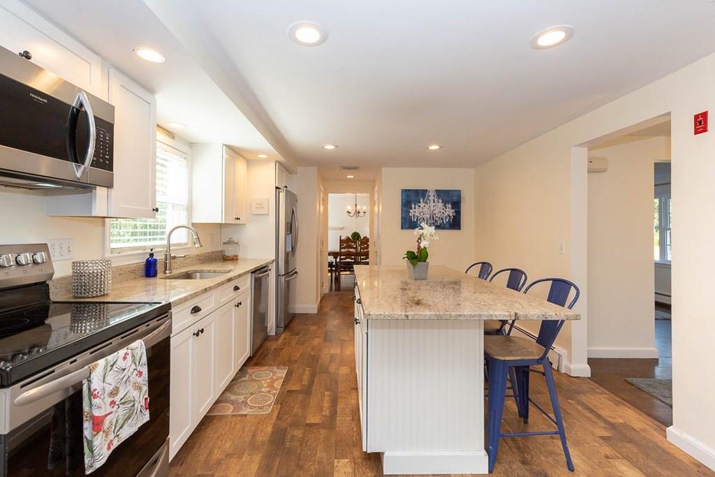 10 Ross Road Lexington, MA 02421 - Photo 15 of 36 a large kitchen with stainless steel appliances granite countertop a lot of counter space and wooden floor