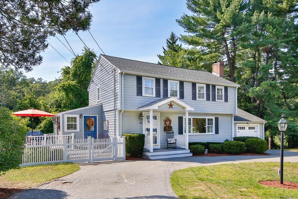 10 Ross Road Lexington, MA 02421 - Photo 2 of 36 a front view of a house with garden