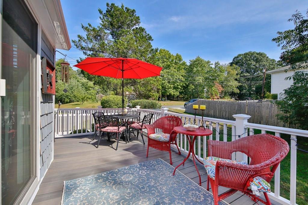 10 Ross Road Lexington, MA 02421 - Photo 21 of 36 an outdoor sitting area with furniture and wooden floor