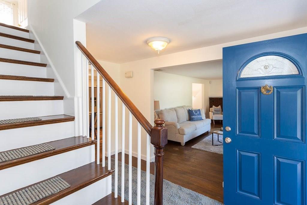 10 Ross Road Lexington, MA 02421 - Photo 23 of 36 a view of front door with wooden floor and stairs