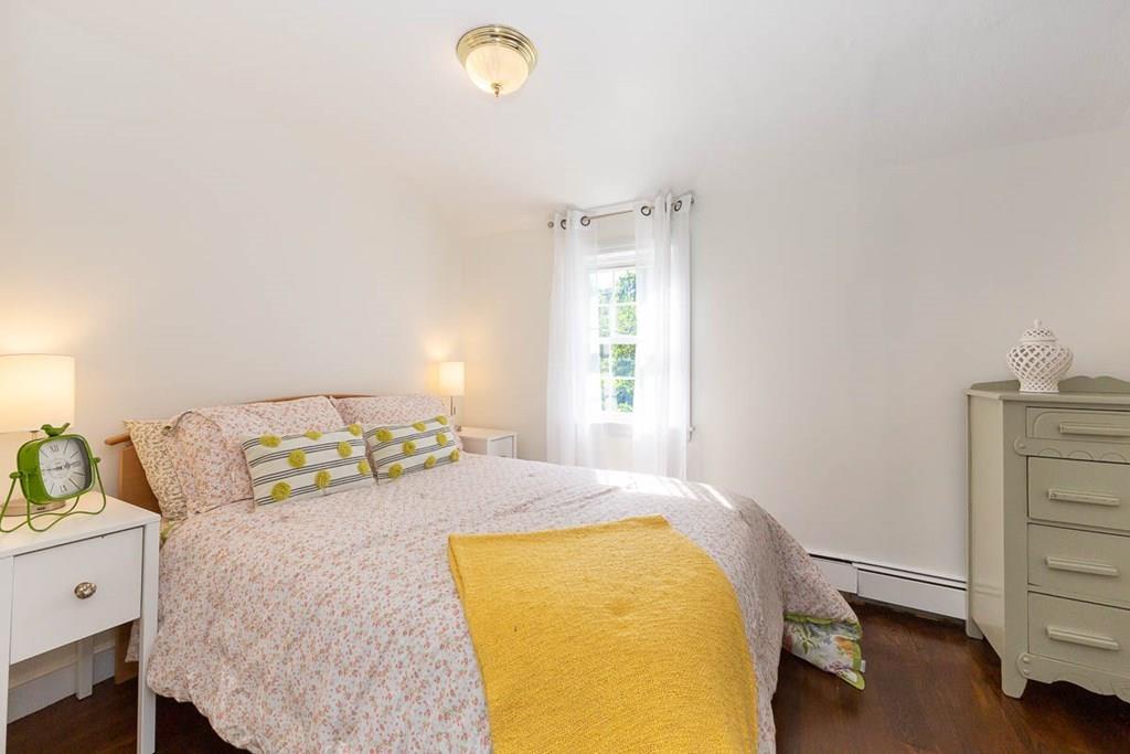 10 Ross Road Lexington, MA 02421 - Photo 24 of 36 a bedroom with a bed and a window