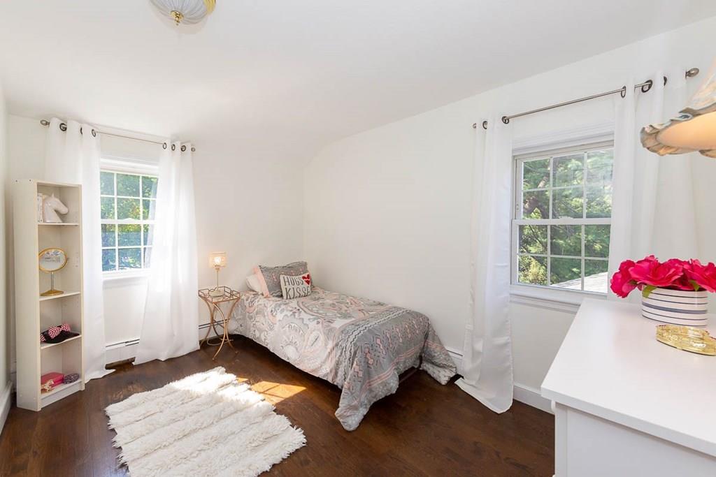 10 Ross Road Lexington, MA 02421 - Photo 27 of 36 a bedroom with a bed and a window
