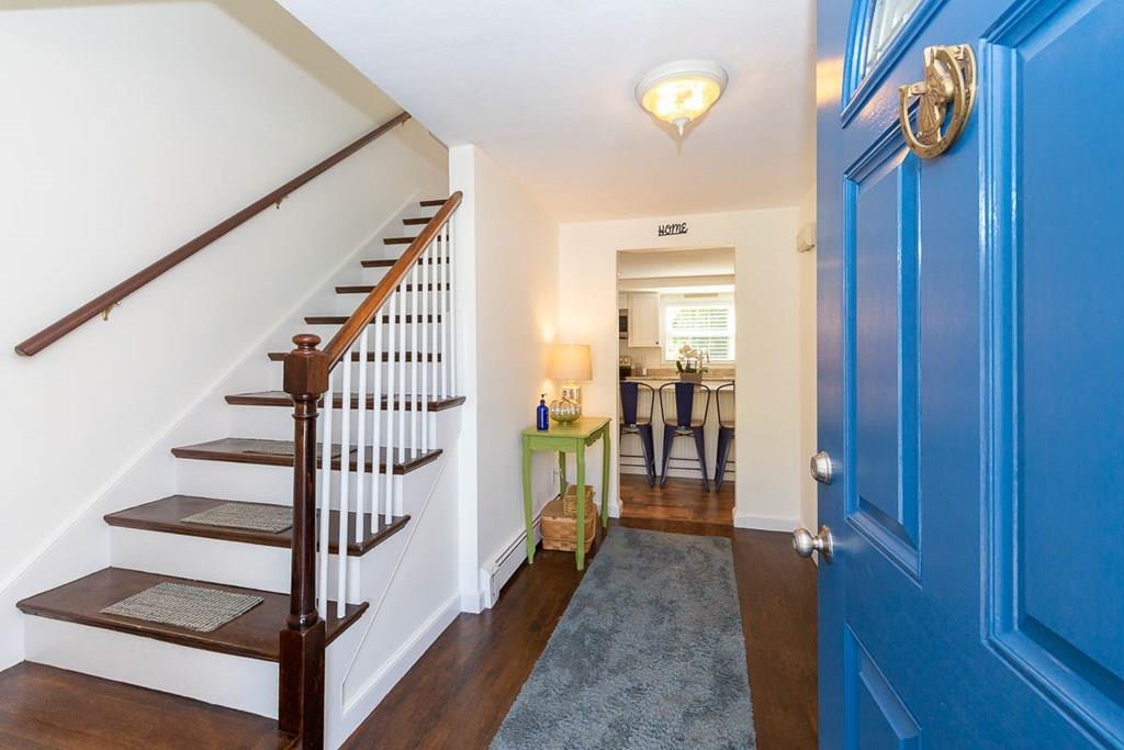 10 Ross Road Lexington, MA 02421 - Photo 5 of 36 a view of hallway with wooden floor and stairs