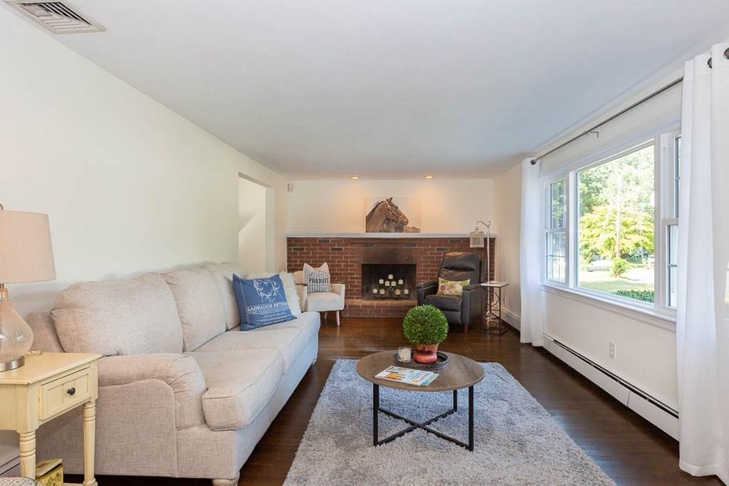 10 Ross Road Lexington, MA 02421 - Photo 7 of 36 a living room with furniture and a fireplace