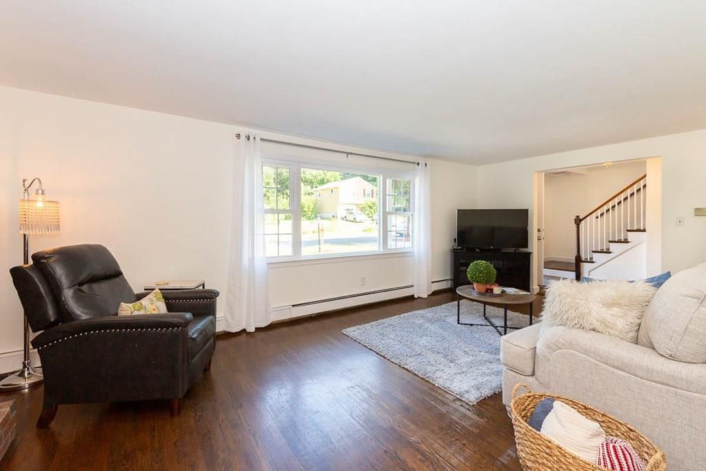 10 Ross Road Lexington, MA 02421 - Photo 8 of 36 a living room with furniture and a window