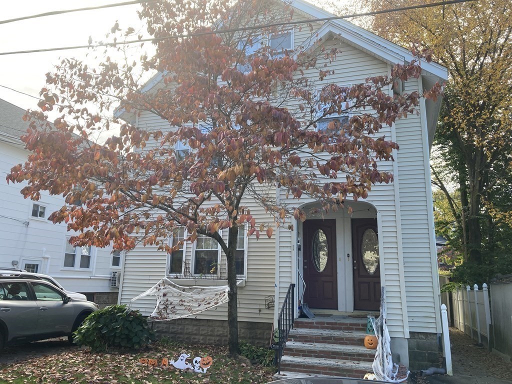 1 Hilltop Road, Unit B Watertown, MA 02472 - Photo 1 of 5 a front view of a house with garden
