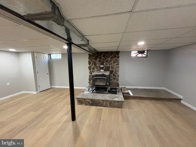 a view of a livingroom with furniture and an entryway