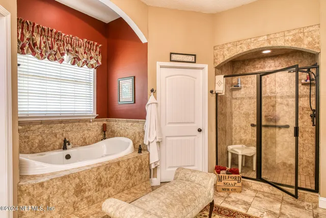 a spacious bathroom with a sink and a bathtub