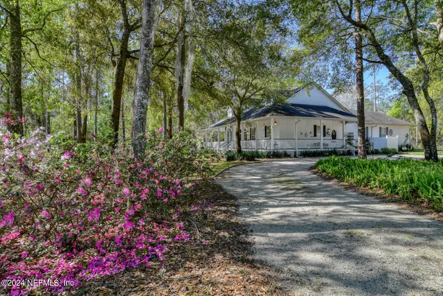 front view of a house with a garden
