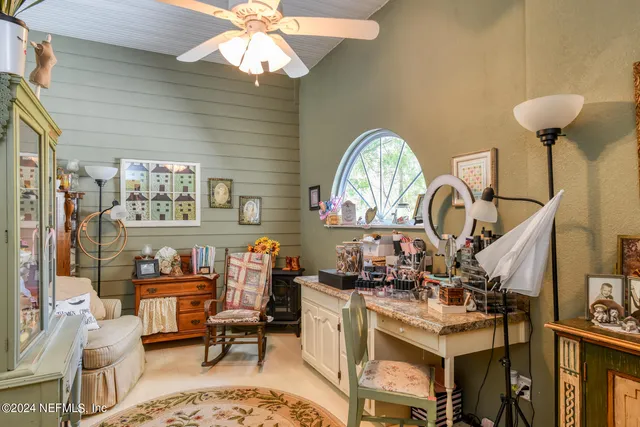 a bedroom with a bed and a lamp with window