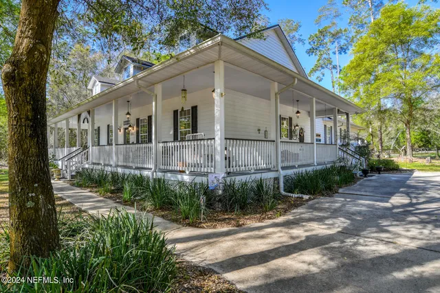 a view of outdoor space with deck and trees