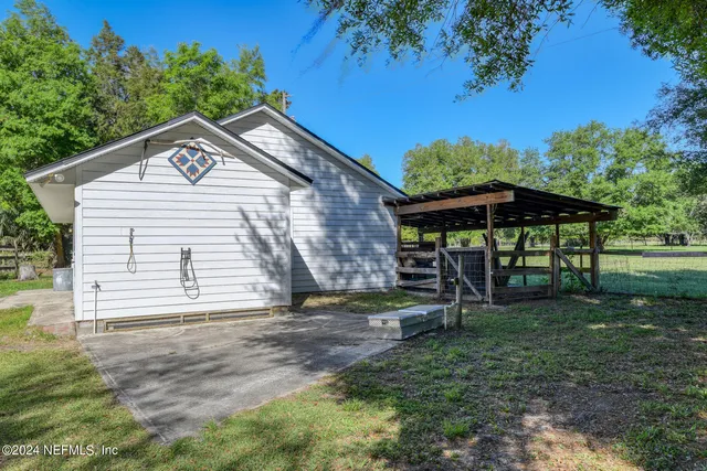 a sign that is sitting in front of flowers