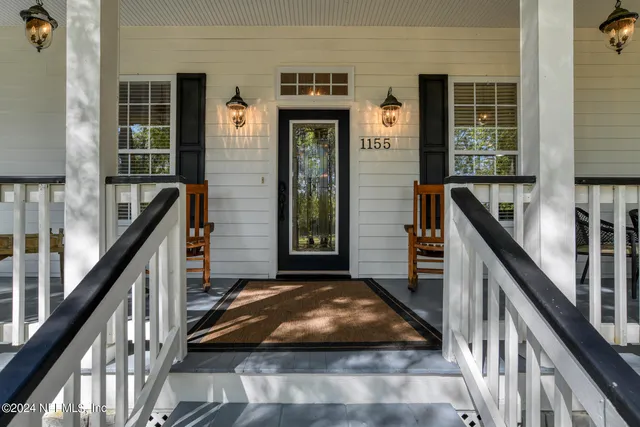 a living room with furniture ceiling fan and a rug