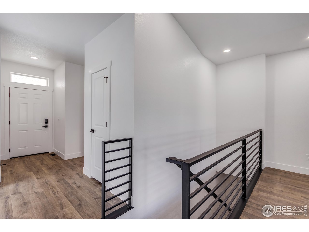 1230 Swainson Road Eaton, CO 80615 - Photo 18 of 29 a view of a hallway with wooden floor