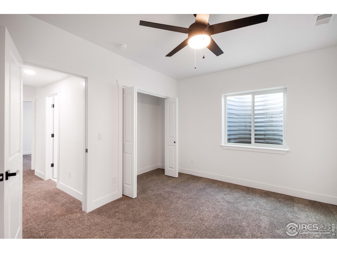 1230 Swainson Road Eaton, CO 80615 - Photo 26 of 29 a view of an empty room with a window