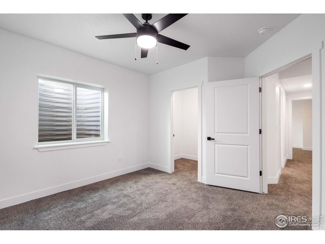 1230 Swainson Road Eaton, CO 80615 - Photo 27 of 29 a view of an empty room with a window