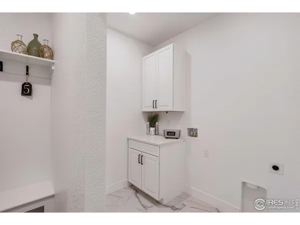 a kitchen with cabinets and window