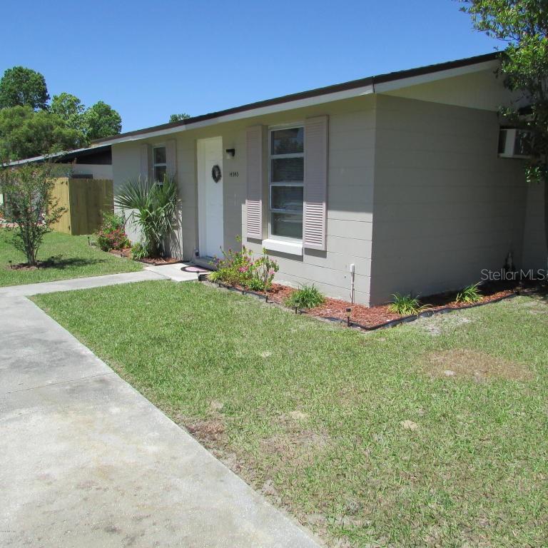 14340 Southwest 39th Ct Road Ocala, FL 34473 - Photo 1 of 1 a front view of a house with garden