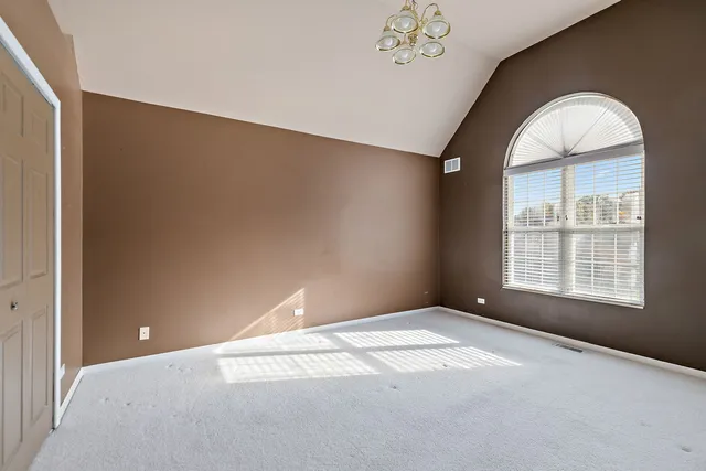 an empty room with a chandeliers