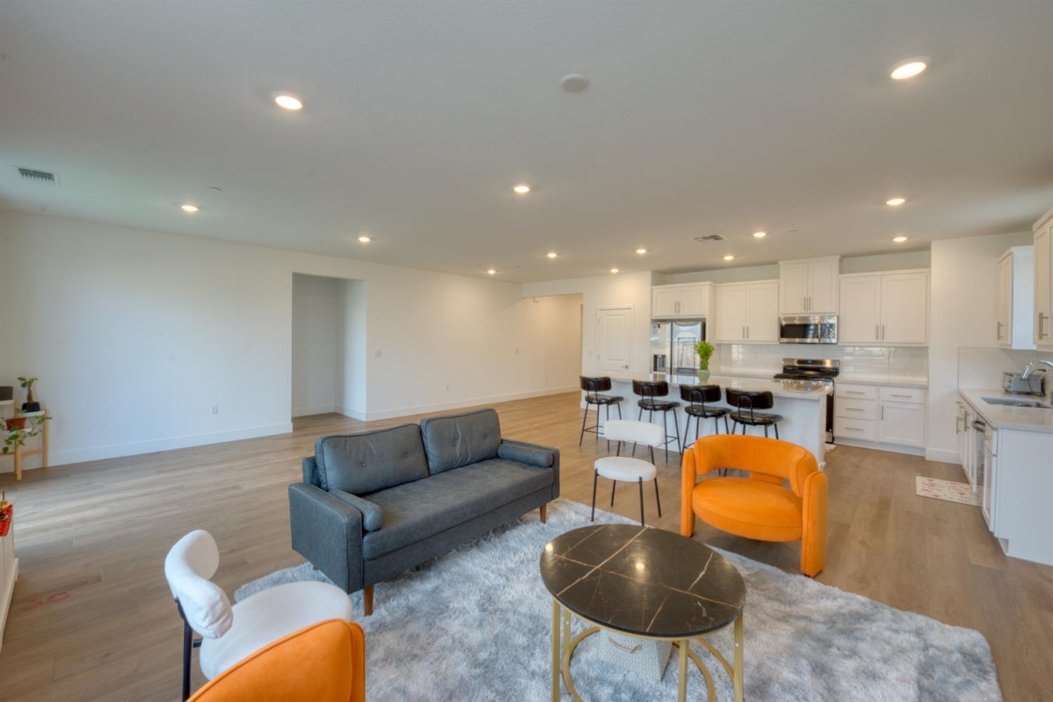 2209 Greenhorn Road Patterson, CA 95363 - Photo 13 of 32 a living room with furniture kitchen and a table
