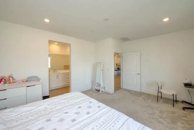 a bedroom with a bed and a cabinets