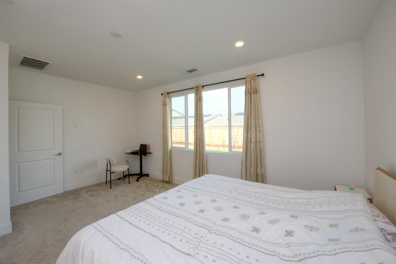 2209 Greenhorn Road Patterson, CA 95363 - Photo 16 of 32 a bedroom with a bed and a window