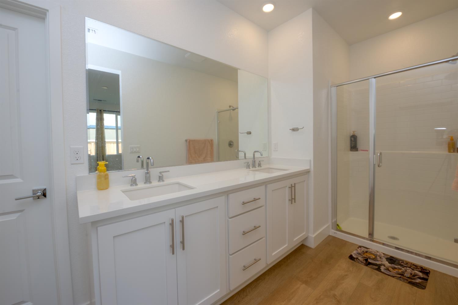 2209 Greenhorn Road Patterson, CA 95363 - Photo 17 of 32 a bathroom with a double vanity sink and mirror