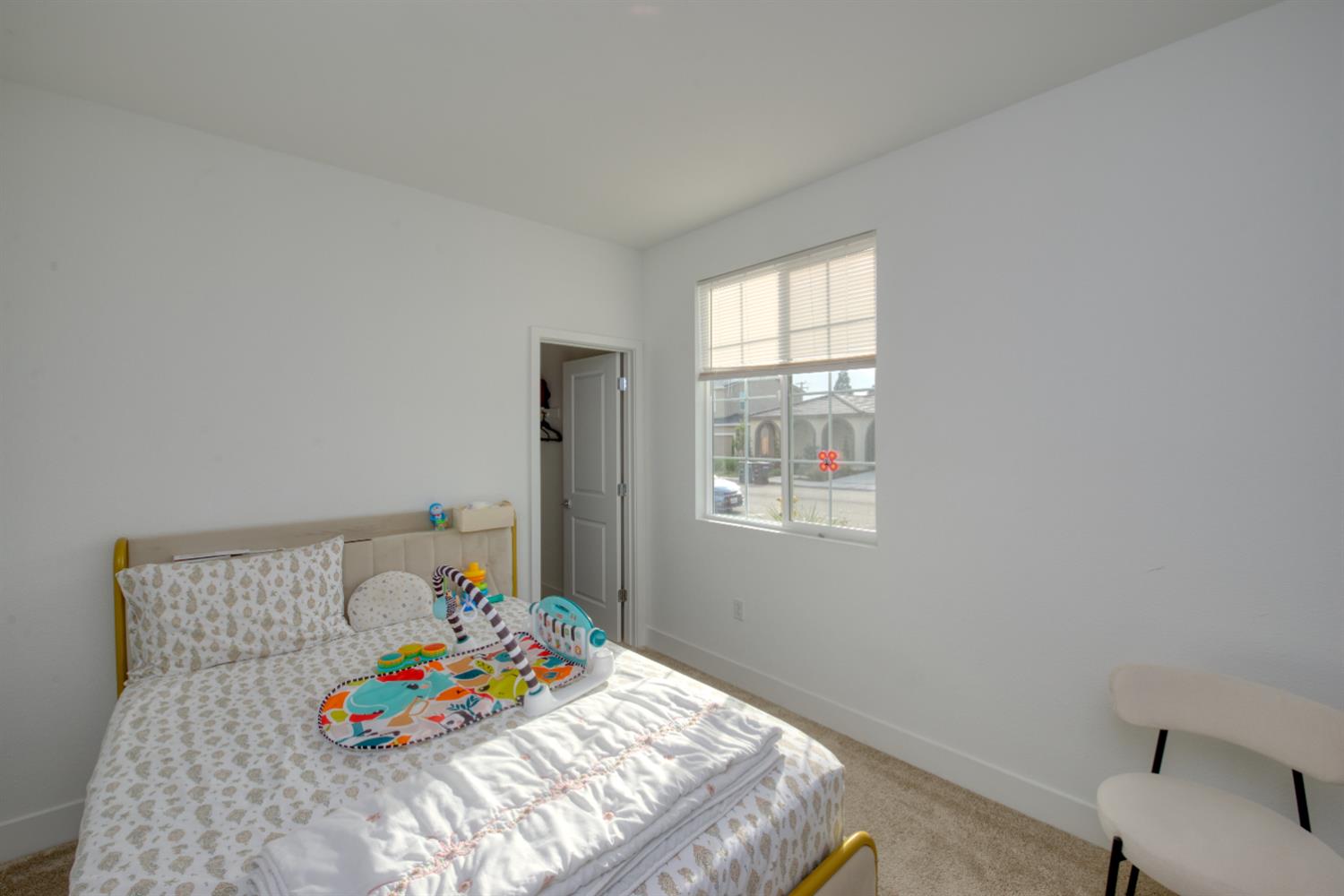 2209 Greenhorn Road Patterson, CA 95363 - Photo 18 of 32 a bedroom with a bed and a couch