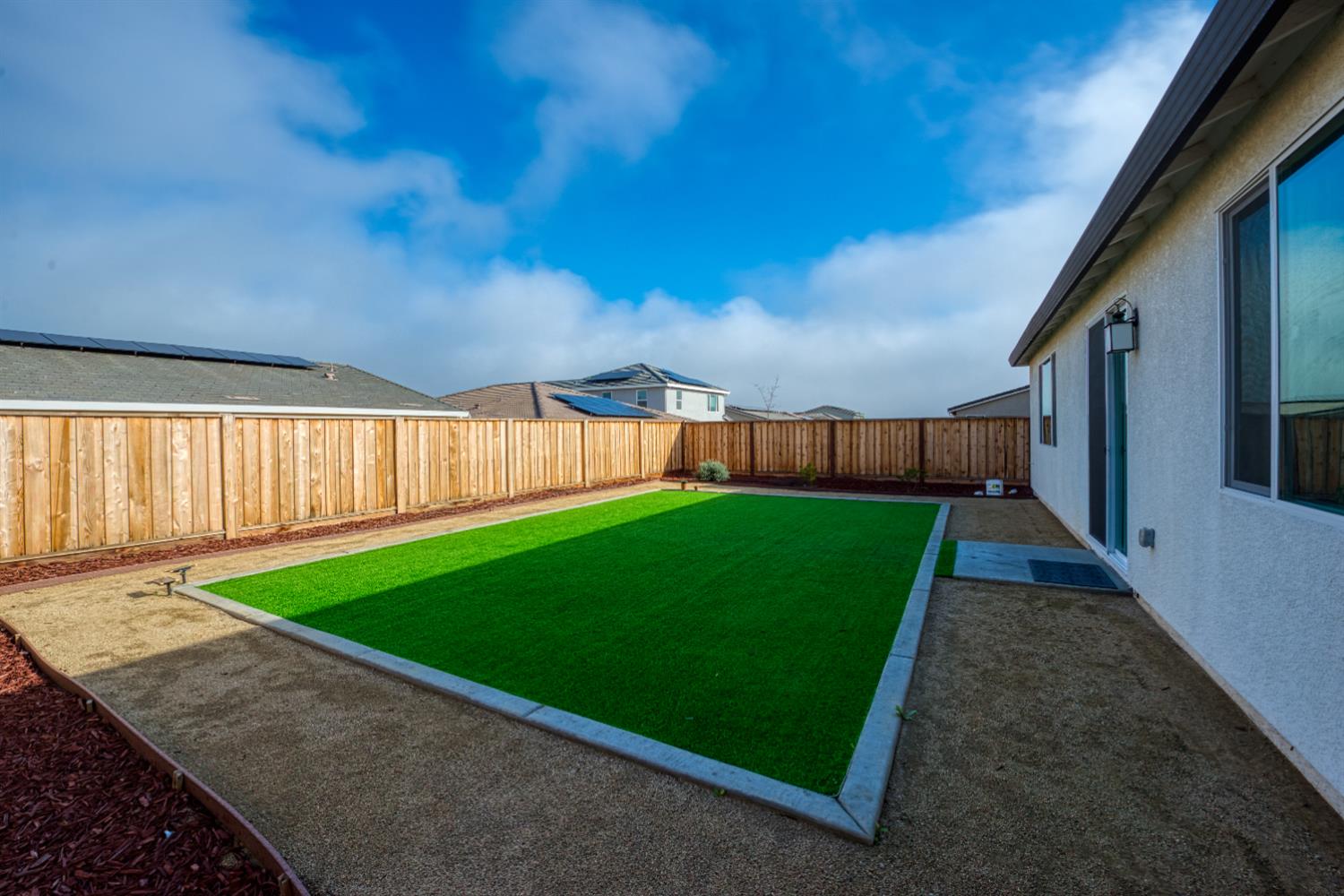 2209 Greenhorn Road Patterson, CA 95363 - Photo 23 of 32 a view of a backyard with grass